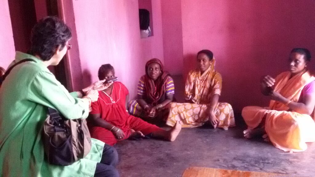 women quilters, discussing about their work and problems